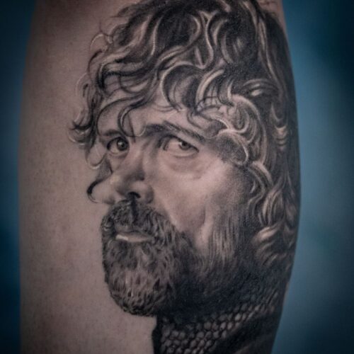 Black and grey realism tattoo of Tyrian Lannister Game of Thrones by Lewis Sherlock
